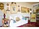 Bright living room with white sofa, colorful rug, and eclectic decor at 748 W Florence Ave, Deland, FL 32720