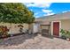 Cozy backyard featuring brick patio, a mature tree, and a porch swing at 8445 Leeland Archer Blvd, Orlando, FL 32836