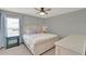 Bedroom featuring a large bed with stylish linens, and side tables at 8445 Leeland Archer Blvd, Orlando, FL 32836