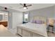Bedroom featuring a large bed with stylish linens, closet, and ensuite bathroom at 8445 Leeland Archer Blvd, Orlando, FL 32836