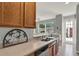 Functional kitchen features light countertops, stainless steel sink and modern appliances at 8445 Leeland Archer Blvd, Orlando, FL 32836