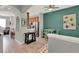 Open concept features bar seating that transitions to a dining area and kitchen with stainless steel appliances at 8445 Leeland Archer Blvd, Orlando, FL 32836