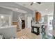 Bright and airy living space features a staircase and is illuminated by recessed lighting at 8445 Leeland Archer Blvd, Orlando, FL 32836