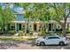 Charming multi-colored townhomes featuring lush landscaping and a neatly paved walkway at 8445 Leeland Archer Blvd, Orlando, FL 32836