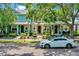 Charming multi-colored townhomes featuring lush landscaping and a neatly paved walkway at 8445 Leeland Archer Blvd, Orlando, FL 32836