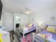 ' bedroom with twin beds, heart wall decor, and ceiling fan at 8518 La Isla Dr, Kissimmee, FL 34747