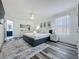 Bright Primary bedroom with ensuite bath, ceiling fan, and modern decor at 8518 La Isla Dr, Kissimmee, FL 34747