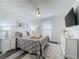 Cozy bedroom with neutral tones, ceiling fan, and stylish decor at 8518 La Isla Dr, Kissimmee, FL 34747