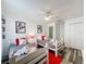 Adorable ' bedroom with twin beds, cartoon art, and a colorful rug at 8518 La Isla Dr, Kissimmee, FL 34747