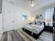 Bedroom boasts gray laminate flooring and neutral walls that are decorated with art prints at 8518 La Isla Dr, Kissimmee, FL 34747