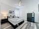 Clean bedroom featuring stylish furnishings, including a ceiling fan and a unique patterned carpet at 8518 La Isla Dr, Kissimmee, FL 34747