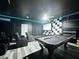 Basement game room has a pool table, theater seating, and accent lighting at 8518 La Isla Dr, Kissimmee, FL 34747