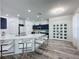 Spacious kitchen offers an island with bar seating, quartz countertops, and stainless appliances at 8518 La Isla Dr, Kissimmee, FL 34747