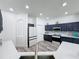 Open kitchen features stainless steel appliances, quartz countertops, and hardwood style floors at 8518 La Isla Dr, Kissimmee, FL 34747