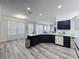 Bright kitchen features quartz countertops, stainless steel appliances, and dark cabinets at 8518 La Isla Dr, Kissimmee, FL 34747
