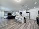Bright open kitchen features an island with bar seating and quartz countertops at 8518 La Isla Dr, Kissimmee, FL 34747