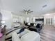 Spacious living room offering modern furnishings and an open layout to the kitchen at 8518 La Isla Dr, Kissimmee, FL 34747