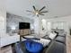Bright open-concept living room with direct access to the dining room and kitchen at 8518 La Isla Dr, Kissimmee, FL 34747