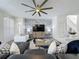 Spacious open-concept living room has stairs, kitchen and dining in view at 8518 La Isla Dr, Kissimmee, FL 34747