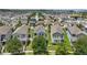 An aerial view of a vibrant neighborhood showcases well-maintained homes and landscaping at 10172 Storey Grove Way, Winter Garden, FL 34787