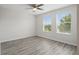 Spacious bedroom features a ceiling fan, luxury vinyl flooring and lots of light at 10172 Storey Grove Way, Winter Garden, FL 34787