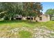 Well-maintained backyard surrounded by lush greenery at 10849 William Tell Dr, Orlando, FL 32821