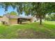 Large backyard featuring a screened-in lanai at 10849 William Tell Dr, Orlando, FL 32821