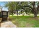 Expansive backyard with mature trees at 10849 William Tell Dr, Orlando, FL 32821