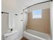 Updated bathroom with tiled shower and tub at 10849 William Tell Dr, Orlando, FL 32821