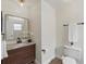 Updated bathroom features a granite countertop and sleek black fixtures at 10849 William Tell Dr, Orlando, FL 32821