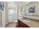 Updated bathroom featuring granite counters, a glass shower, and modern fixtures at 10849 William Tell Dr, Orlando, FL 32821