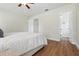 Bright bedroom features hardwood floors and an ensuite bathroom at 10849 William Tell Dr, Orlando, FL 32821