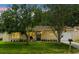 Charming single-story home with well-maintained lawn and mature trees in a tranquil setting at 10849 William Tell Dr, Orlando, FL 32821