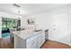 Kitchen island offers ample counter space with granite countertops and stainless steel appliances at 10849 William Tell Dr, Orlando, FL 32821