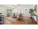 Bright and stylish living room with hardwood floors, plenty of seating, and natural light at 10849 William Tell Dr, Orlando, FL 32821