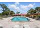 Community pool surrounded by lounge chairs, offering a relaxing and refreshing experience at 10849 William Tell Dr, Orlando, FL 32821