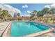 Beautiful community pool with lounge seating, perfect for relaxation and socializing at 10849 William Tell Dr, Orlando, FL 32821