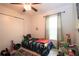 Cozy bedroom with a ceiling fan, large closet and playful dinosaur-themed decor at 1108 Northlake Dr # 1108, Sanford, FL 32773