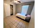 Cozy bedroom featuring a ceiling fan, window, and a comfortable bed at 1108 Northlake Dr # 1108, Sanford, FL 32773