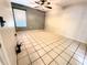 Spacious bedroom showcasing tile flooring, neutral walls, and a ceiling fan at 1108 Northlake Dr # 1108, Sanford, FL 32773