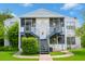 Inviting two-story exterior showcasing well-maintained landscaping and screened-in patios, perfect for relaxing outdoors at 1108 Northlake Dr # 1108, Sanford, FL 32773