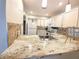Stylish kitchen features granite counters, bright cabinets, and modern appliances, creating a functional and appealing space at 1108 Northlake Dr # 1108, Sanford, FL 32773