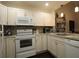Bright kitchen with white cabinets, modern appliances, and a stylish backsplash at 1108 Northlake Dr # 1108, Sanford, FL 32773