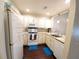 Efficient kitchen design with modern appliances, light cabinetry, and ample counter space, perfect for everyday cooking at 1108 Northlake Dr # 1108, Sanford, FL 32773