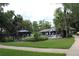 A community pool surrounded by lush landscaping and sun loungers for residents at 1108 Northlake Dr # 1108, Sanford, FL 32773