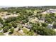 Aerial shot displaying home in a vibrant community near local roads, surrounded by lush trees at 1119 W 7Th St, Sanford, FL 32771