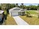 Aerial view showcasing a home with a brick driveway and lush landscaping at 1119 W 7Th St, Sanford, FL 32771