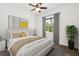 Stylishly furnished bedroom featuring a comfortable bed, decorative pillows, and ample natural light at 1119 W 7Th St, Sanford, FL 32771