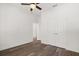 Bedroom with hardwood floors, ceiling fan, and doors for closet and bathroom at 1119 W 7Th St, Sanford, FL 32771