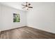 Bedroom with light-colored walls and window that offers a view of the greenery outside at 1119 W 7Th St, Sanford, FL 32771